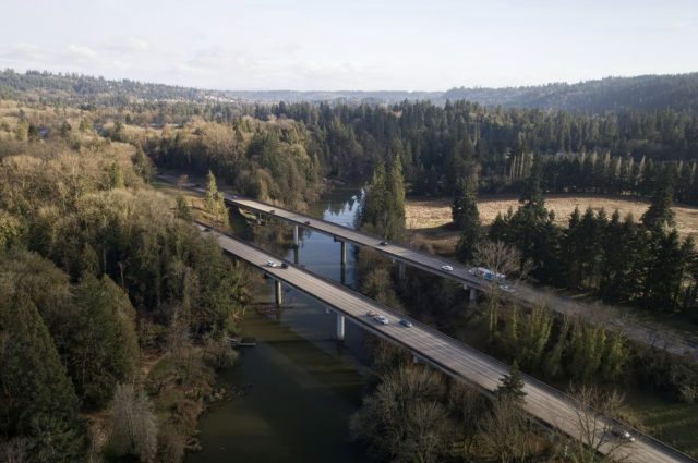 A bridge carries I-205 over the Tualatin River near West Linn, OR, seen from the air on Wed., Feb. 8, 2023.Dave Killen / The Oregonian